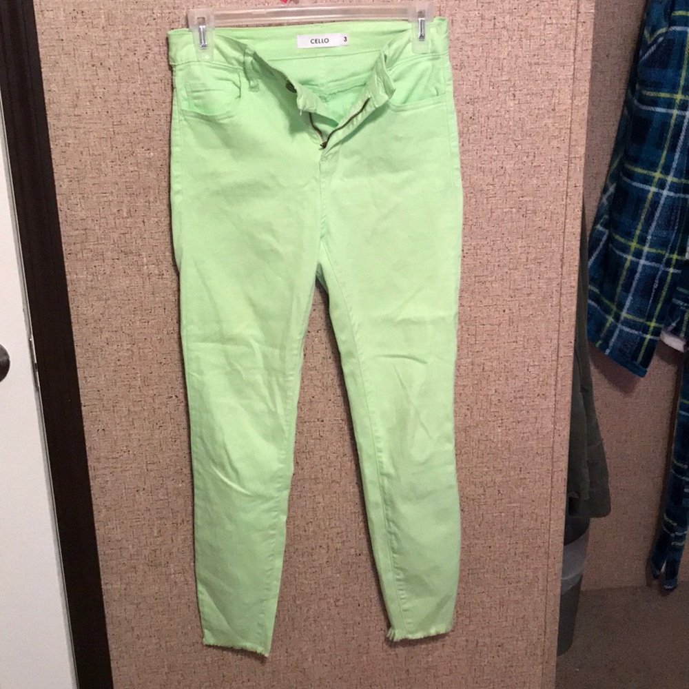 Lime green skinny distressed ankle jeans